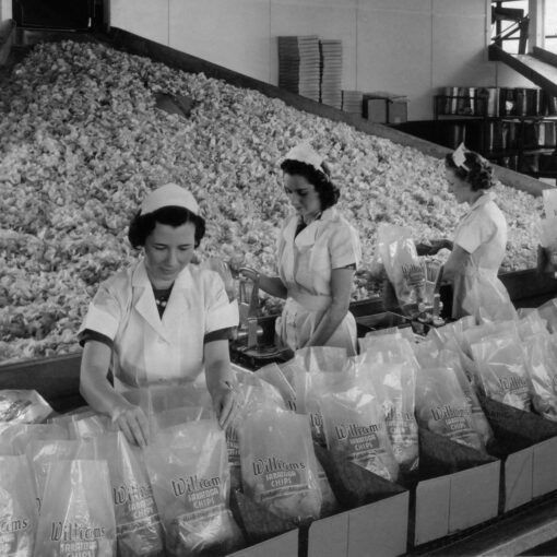 Next Generation Cooking - A old black and white image of women packing food in a factory.